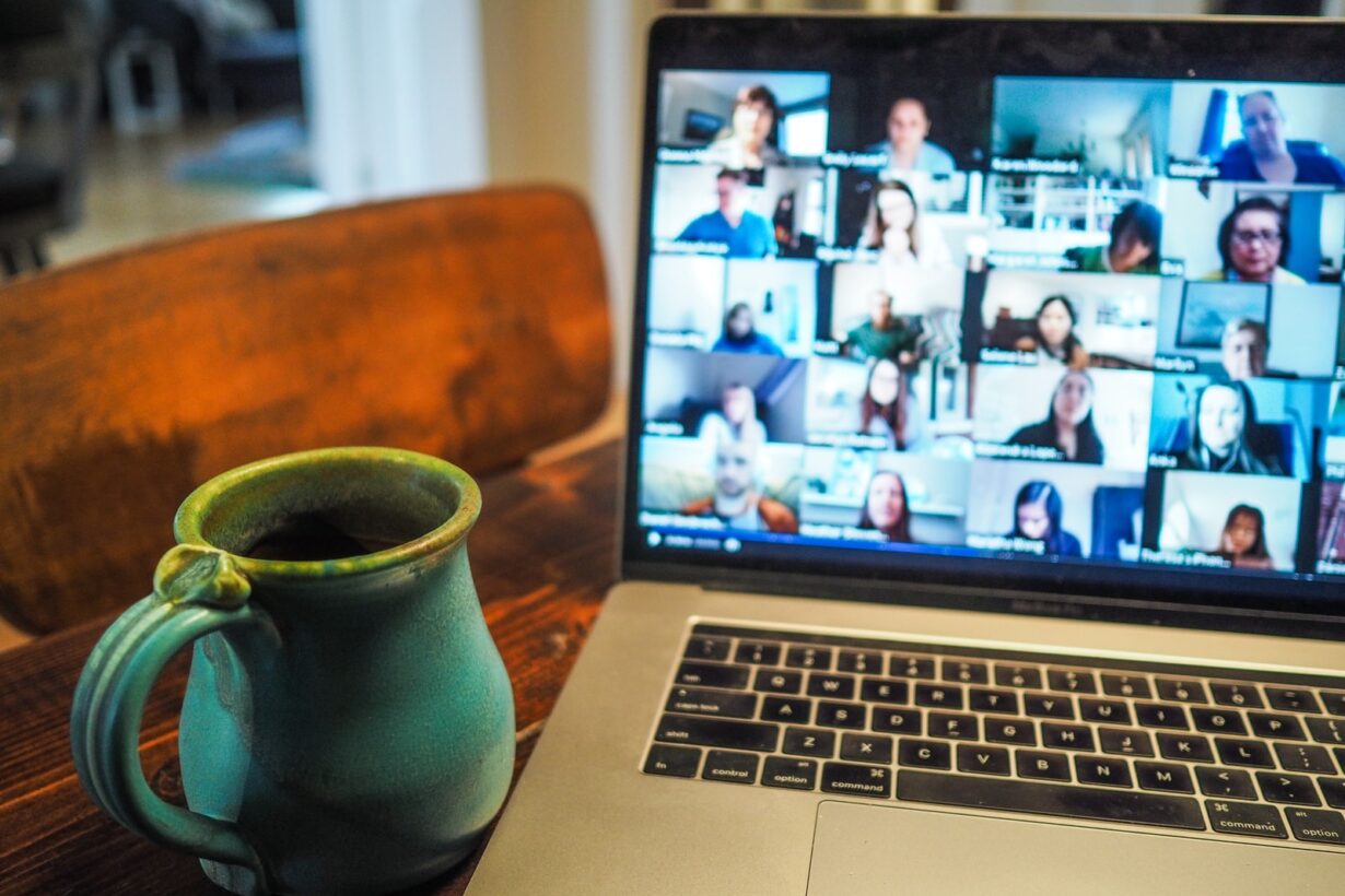 macbook pro displaying group of people